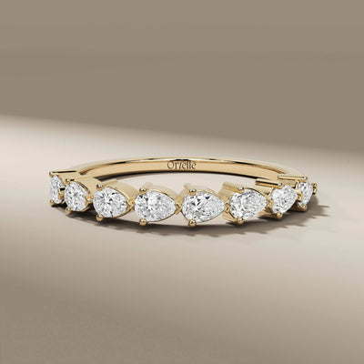 pear cut diamond shared prong half eternity wedding band
