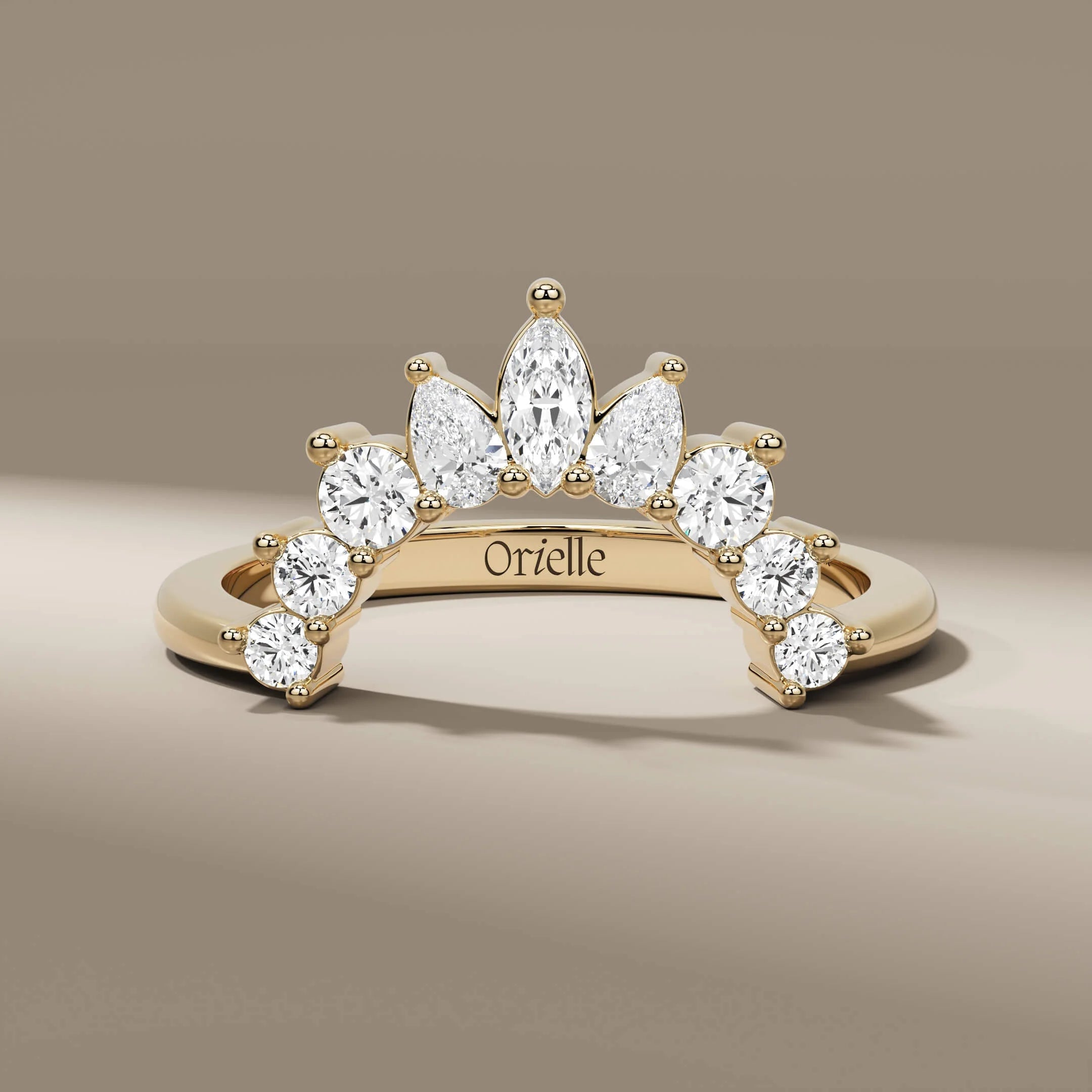 curved wedding band with marquise pear and round diamonds
