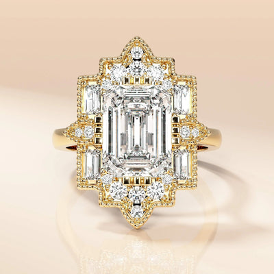 Emerald diamond ring with vintage gold halo design