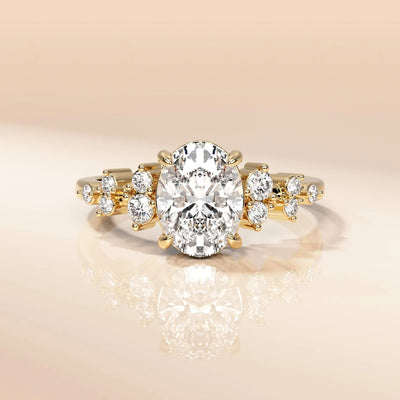 Handmade oval cut ring featuring sparkling round side stones
