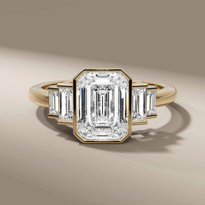 emerald cut diamond ring with side stone baguette accents
