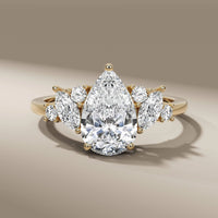 Pear Cut Diamond Ring With Side Stone Marquise And Round