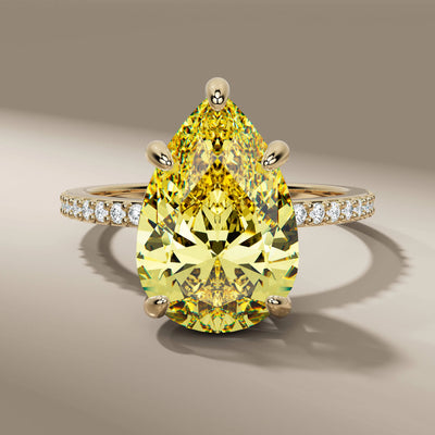 pear cut diamond ring with canary yellow diamond center
