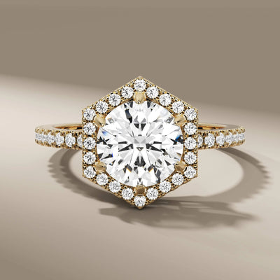 halo engagement ring with round diamond in prong setting
