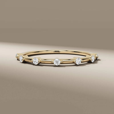 minimalist distance pave round diamond wedding band

