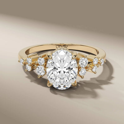oval engagement ring in yellow gold with claw prong setting
