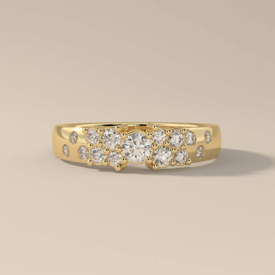 Designer wedding band in yellow gold with prong set moissanite
