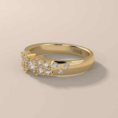 Yellow gold side stone band featuring prong set moissanite
