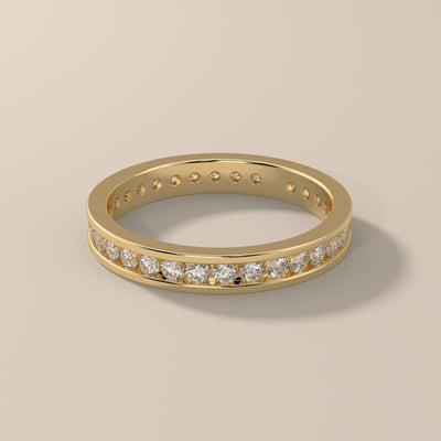 channel set wedding band with full eternity round diamonds
