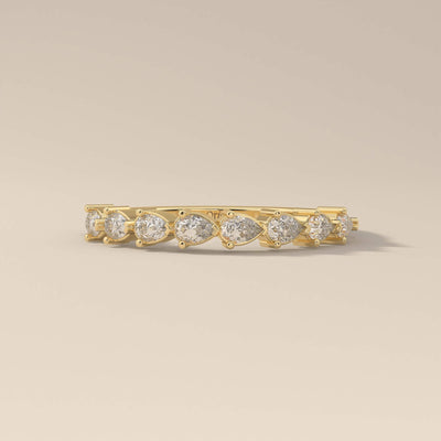 pear wedding band with shared prong half eternity design
