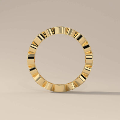 round moissanite eternity wedding band in yellow gold
