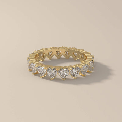Moissanite promise band with heart shape in prong setting
