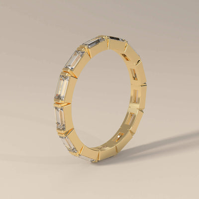 designer moissanite baguette wedding band in yellow gold
