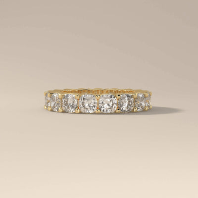 Cushion cut full eternity wedding band in classic yellow gold
