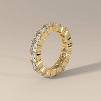 Unique design cushion band with full eternity shared prongs
