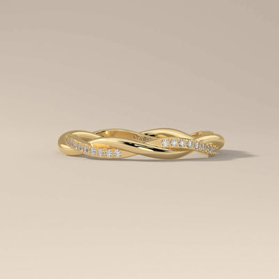 Designer twisted wedding band with round cut shared prong setting
