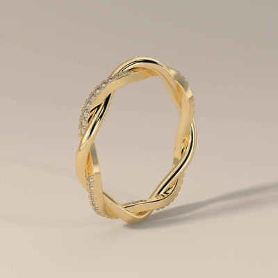 Unique twisted shared prong wedding band in yellow gold
