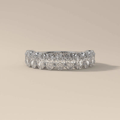 Half eternity moissanite promise band with handmade gold detail
