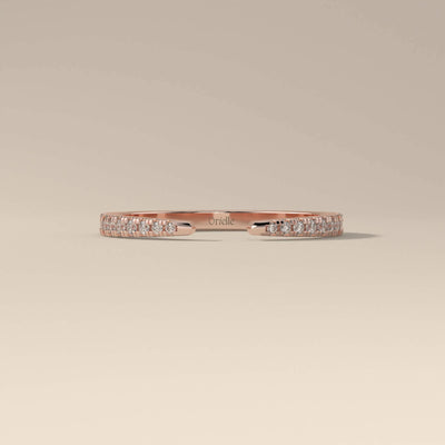 moissanite promise band in yellow gold with prong setting
