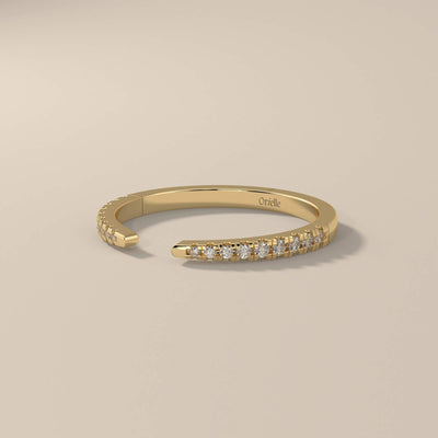 prong setting wedding band in polished yellow gold finish
