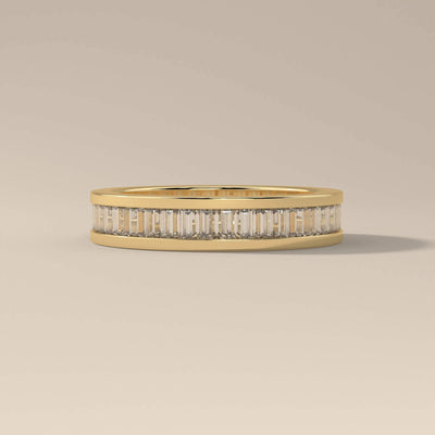 Baguette wedding band crafted in polished yellow gold
