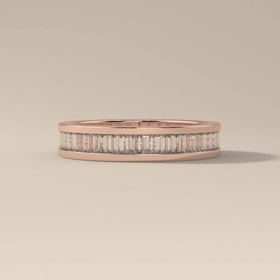Bezel set wedding band in a slim yellow gold profile
