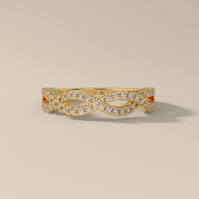 infinity style twisted wedding band with round moissanite
