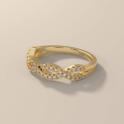 white gold infinity style round moissanite wedding band

