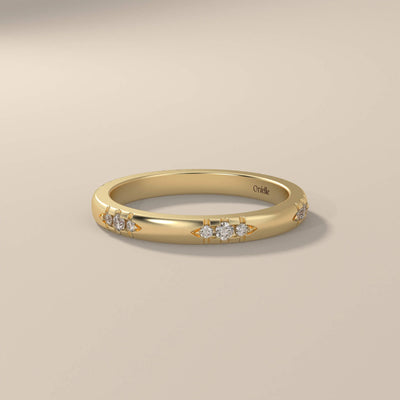 Round cut yellow gold band with designer minimalist setting

