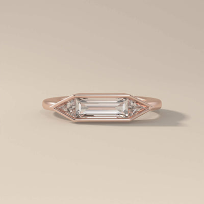 Moissanite promise ring with baguette and trilliant accents
