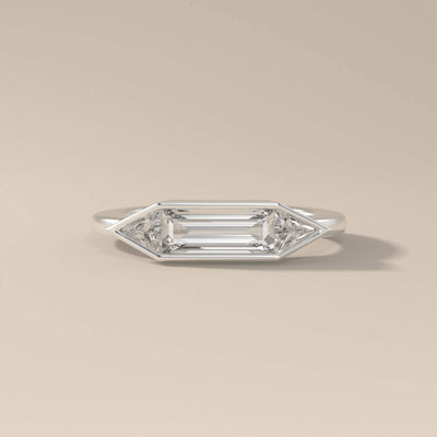 Yellow gold bezel set ring with geometric stone layout
