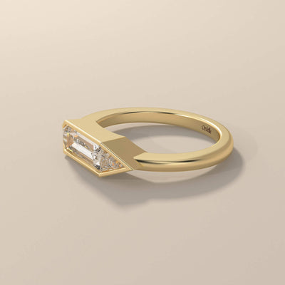 Yellow gold three stone engagement ring with classic styling
