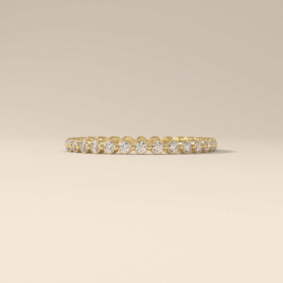 handmade yellow gold round moissanite micro pave band
