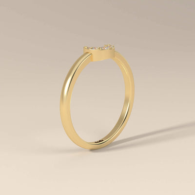 Yellow gold half moon band featuring round cut stones
