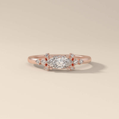 Side stone engagement ring crafted in a vintage-inspired look
