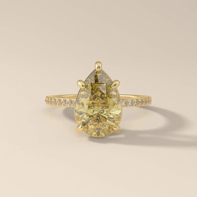 Pear cut moissanite ring with canary yellow center
