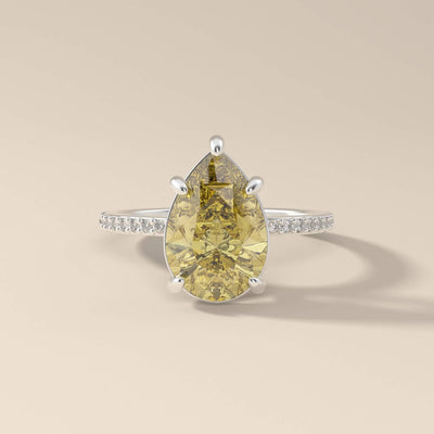 Yellow pear moissanite ring with claw prongs
