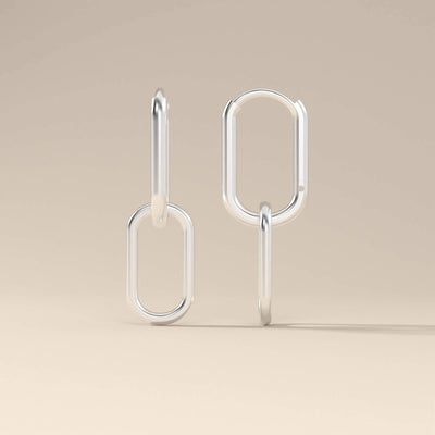Minimalist yellow gold hoop earrings with paperclip link shape
