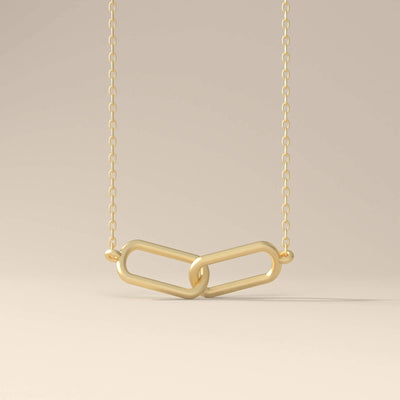 Gold link necklace with minimalist pendant design
