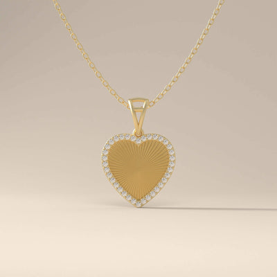 Yellow gold heart pendant with round halo design
