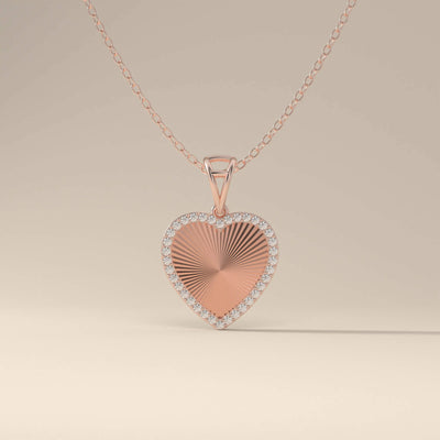 Handmade gold heart pendant with halo setting

