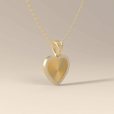 Shared prong halo heart pendant in yellow gold
