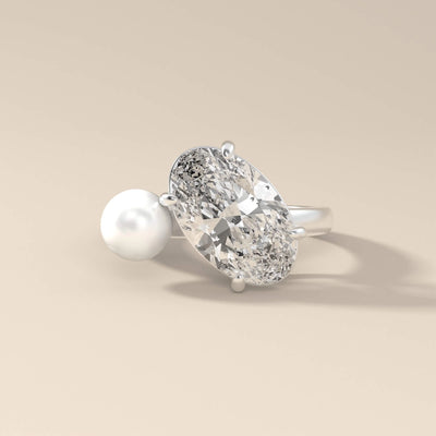 Oval moissanite promise ring with pearl accent stone
