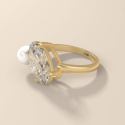 Pearl stone ring paired with oval cut moissanite
