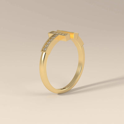 T-style yellow gold ring featuring moissanite center

