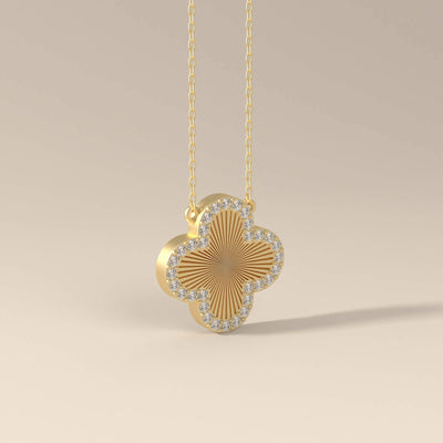 Round diamond clover necklace in gold setting
