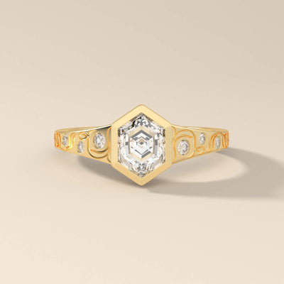 Hexagon cut engagement ring in yellow gold with modern style
