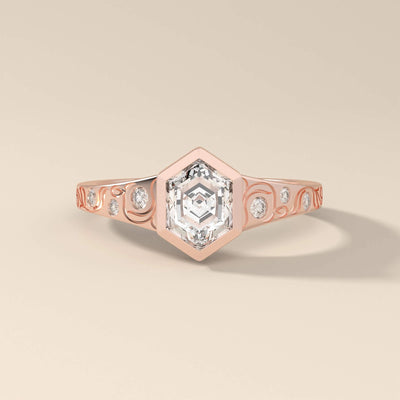 Unique design engagement ring with round side stone accents
