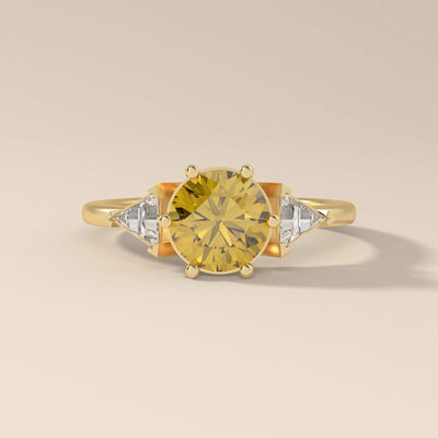 Elegant round moissanite engagement ring in yellow gold with a classic prong setting

