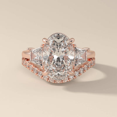 shared prong wedding band styled with oval cut engagement design
